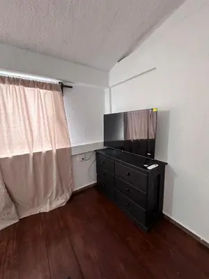 Una televisión o centro de entretenimiento en Departamento mini Huatulco