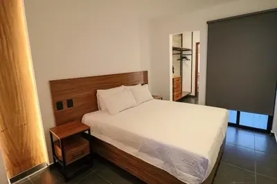Cama o camas de una habitación en Palmas Luxury Apartment 106