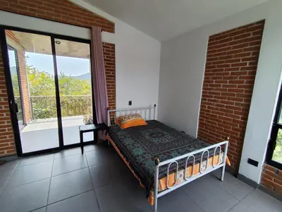 Cama o camas de una habitación en Casa de campo con alberca