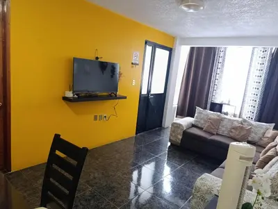 Una televisión o centro de entretenimiento en Hogar Díaz, Tradición y Confort en el Centro, 2BR