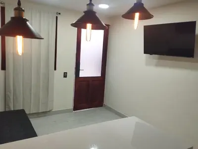 Una televisión o centro de entretenimiento en Hermosa casita en el centro de Tlatlauquitepec Pueblo Magico