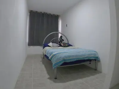 Cama o camas de una habitación en Depto Zona UV Lagos Isleta 103