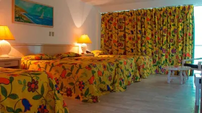 Cama o camas de una habitación en Hotel Sands Acapulco