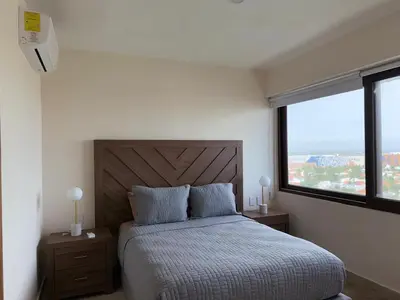 Cama o camas de una habitación en Apartment in Dos Arenas Marina Residencial