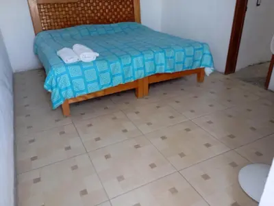 Cama o camas de una habitación en Casa rústica en zona dorada Cerca zona hoteles restaurantes y tiendas Casa privada con Muchas habitaciones