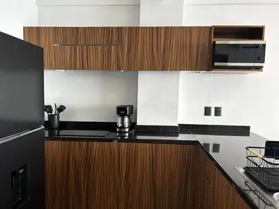 Una cocina o zona de cocina en Frente a la Playa con acceso directo AC Alberca y Elevador