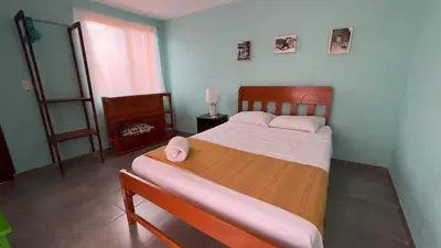 Cama o camas de una habitación en La Chinanteca, a unos minutos del centro historico