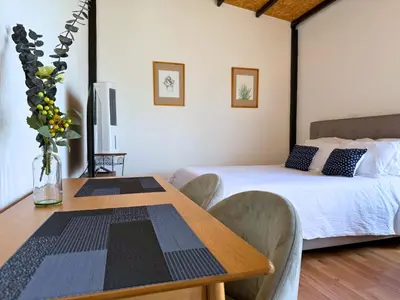 Cama o camas de una habitación en Your Cozy Corner in Oaxaca with AC