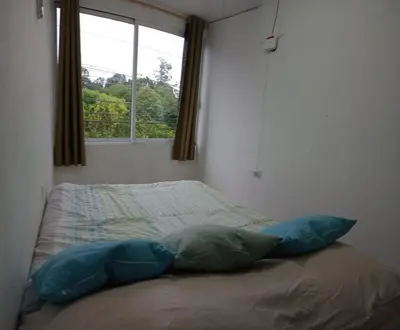 Cama o camas de una habitación en Depto Zona UV Lagos Isleta 102