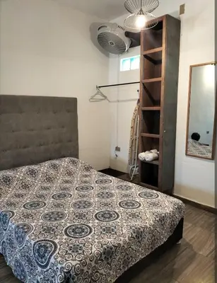 Cama o camas de una habitación en Cuatro Rumbos Hospedaje