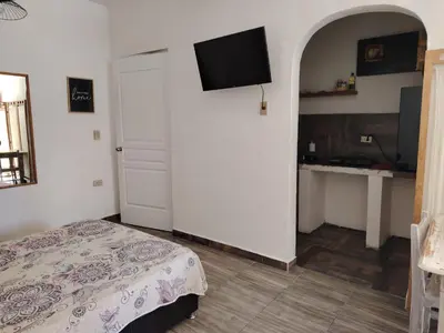 Cama o camas de una habitación en Cuatro Rumbos Hospedaje