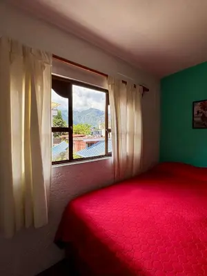 Cama o camas de una habitación en Hospedaje Teponaztle