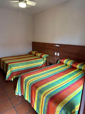 Cama o camas de una habitación en Hotel Posada del Rosario