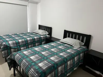 Cama o camas de una habitación en Departamento en Residencial
