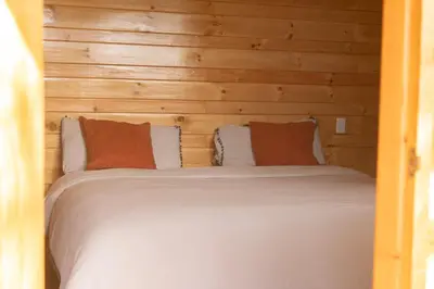 Cama o camas de una habitación en San José del Pacífico- Cabañas Camino al Cielo 1