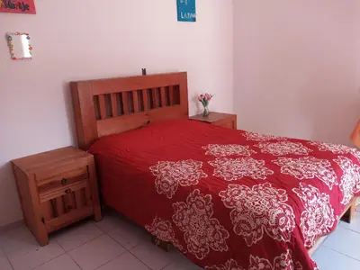 Cama o camas de una habitación en Casa familiar cerca del Centro