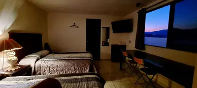 Cama o camas de una habitación en Hotel El Eden 4 per 15
