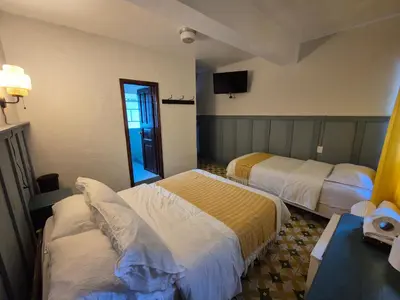 Cama o camas de una habitación en Hotel Posada Doña Carito