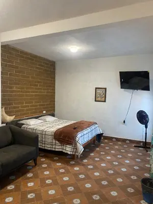 Cama o camas de una habitación en Casa HUEHUE