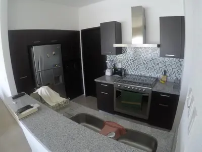 Una cocina o zona de cocina en Departamento Paraiso Country Club-Morelos