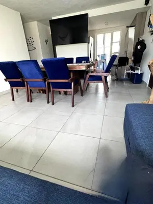 Una televisión o centro de entretenimiento en Departamento P B con Club de Playa Zona Diamante