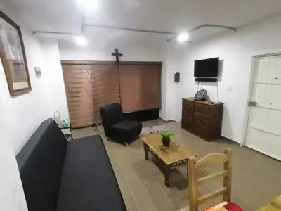 Una televisión o centro de entretenimiento en Beautiful apartment in Orizaba