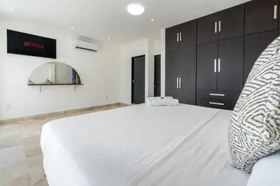 Cama o camas de una habitación en Villas Acapulco Punta Diamante