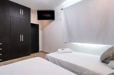 Cama o camas de una habitación en Villas Acapulco Punta Diamante