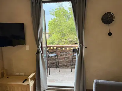 Una televisión o centro de entretenimiento en Fiore Master en ValQuirico