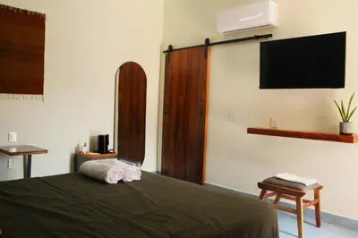 Cama o camas de una habitación en Casa de Alicia - Habitación Xaguar