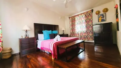Cama o camas de una habitación en Casa Rosa Paradise