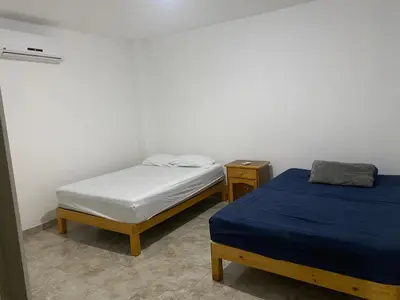 Cama o camas de una habitación en Bungalow cielo azul