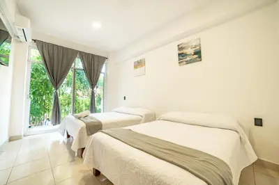 Cama o camas de una habitación en Hotel Catedral Jojutla