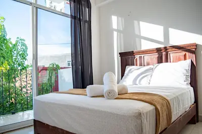 Cama o camas de una habitación en Hotel Catedral Jojutla