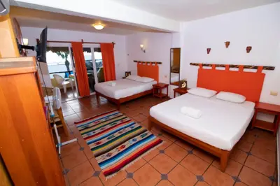Cama o camas de una habitación en BEACH HOTEL INES en Zicatela