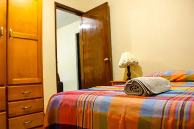 Cama o camas de una habitación en Casa Lucero Oaxaca