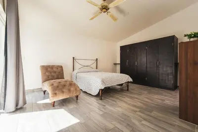 Cama o camas de una habitación en Gran casa con alberca climatizada jacuzzi y asador