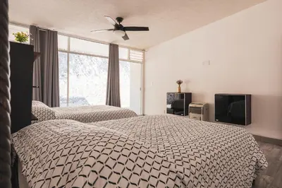 Cama o camas de una habitación en Gran casa con alberca climatizada jacuzzi y asador