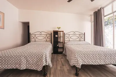 Cama o camas de una habitación en Gran casa con alberca climatizada jacuzzi y asador
