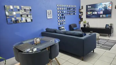 Zona de estar de Departamento y Terraza Privada, Grill, Alberca y Aire Acondicionado
