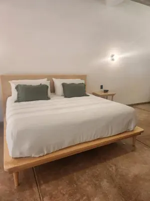 Cama o camas de una habitación en Casa Nuestra Hotel Boutique y Experiencias para Compartir
