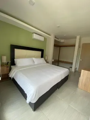 Cama o camas de una habitación en Family Vacations Incredible Beach and Pool