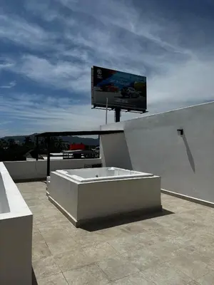 Una televisión o centro de entretenimiento en CASCATTA Residencial Diamante