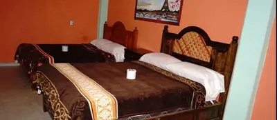 Cama o camas de una habitación en HOTEL AYOQUEZCO a