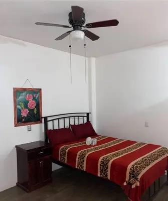 Cama o camas de una habitación en HOTEL AYOQUEZCO a