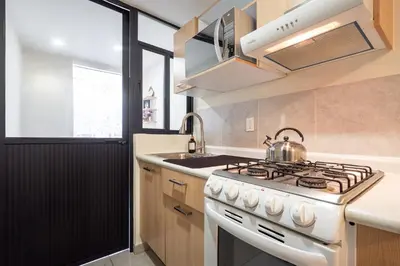 Una cocina o zona de cocina en Apto a Pasos del GNP y Aeropuerto