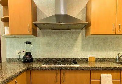 Una cocina o zona de cocina en Departamento Mayan Lakes T11 - Albercas, club de playa, tenis, pádel y más