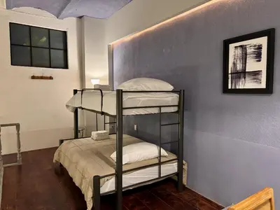 Cama o camas de una habitación en Vista Única a la Catedral desde tu Balcón Privado