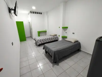 Cama o camas de una habitación en Mini departamento céntrico