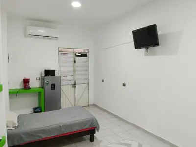 Una televisión o centro de entretenimiento en Mini departamento céntrico